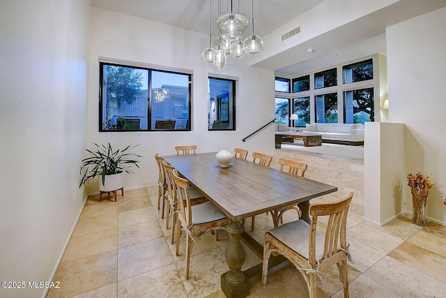 6530 N Finisterra, Tucson, AZ 85750 - dining room with plenty of natural light, a chandelier, and light tile patterned floors