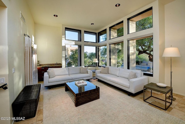 6530 N Finisterra, Tucson, AZ 85750 - tiled living room with recessed lighting and a towering ceiling