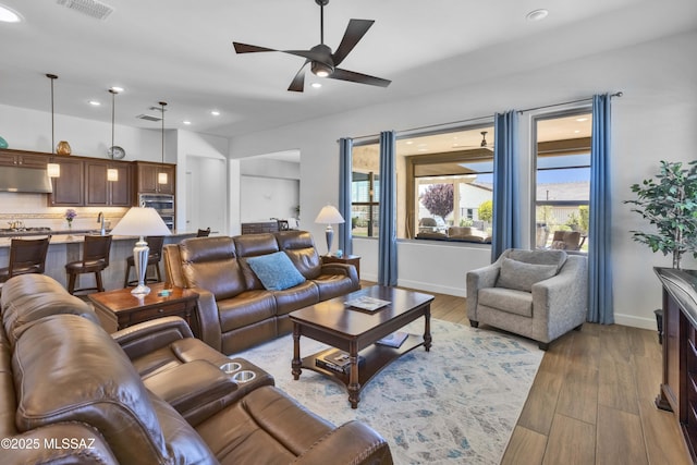 31618 S Tamarisk Pl, Oracle, AZ 85623 - living room with ceiling fan, wood finished floors, and recessed lighting