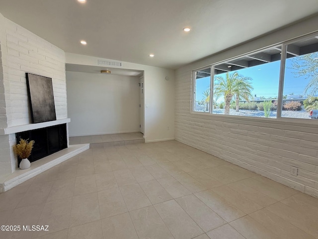 8324 E Beverly St, Tucson, AZ 85710 - unfurnished living room with recessed lighting, tile patterned flooring, and a fireplace