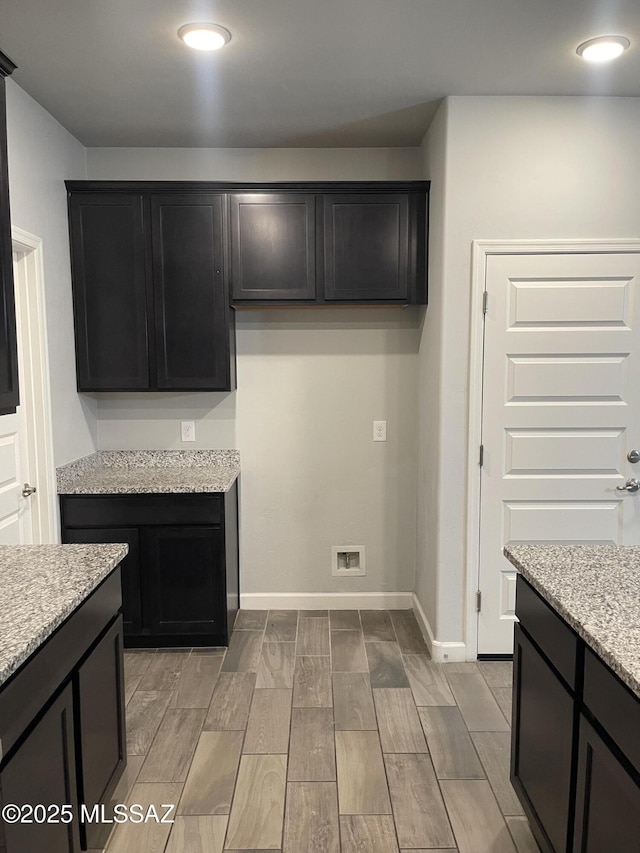 3306 N Baby Bruno Way, Tucson, AZ 85745 - kitchen featuring light stone countertops, wood finish floors, and recessed lighting