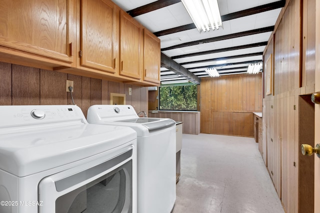 149 E La Huerta, Green Valley, AZ 85614 - laundry room with cabinet space, washer and dryer, and wood walls