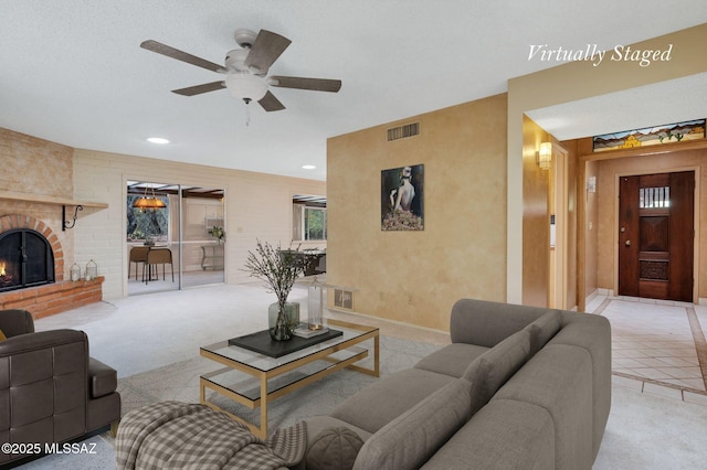 149 E La Huerta, Green Valley, AZ 85614 - living room featuring a ceiling fan, a brick fireplace, carpet flooring, and recessed lighting
