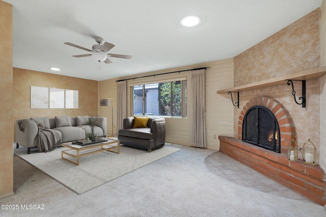 149 E La Huerta, Green Valley, AZ 85614 - living room with ceiling fan, a brick fireplace, carpet flooring, and recessed lighting