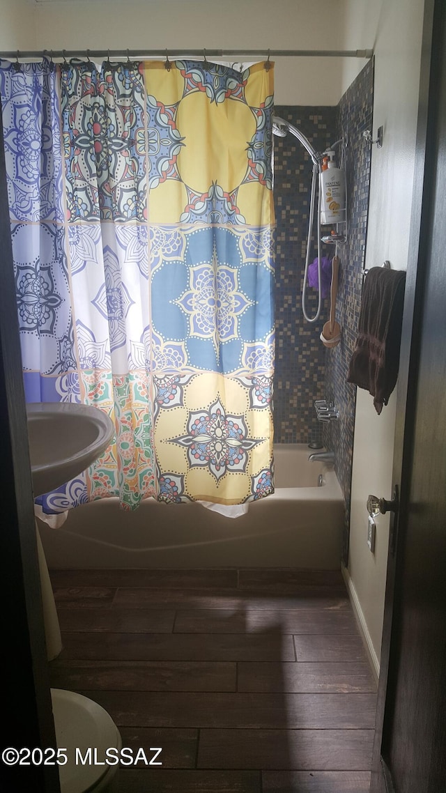 1816 E Waverly St, Tucson, AZ 85719 - full bathroom featuring wood finished floors and shower / tub combo with curtain