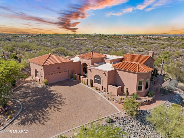 1511 E Placita Meseta Dorada, Oro Valley, AZ 85755 - view of front of home featuring stucco siding, a tile roof, an attached garage, and driveway