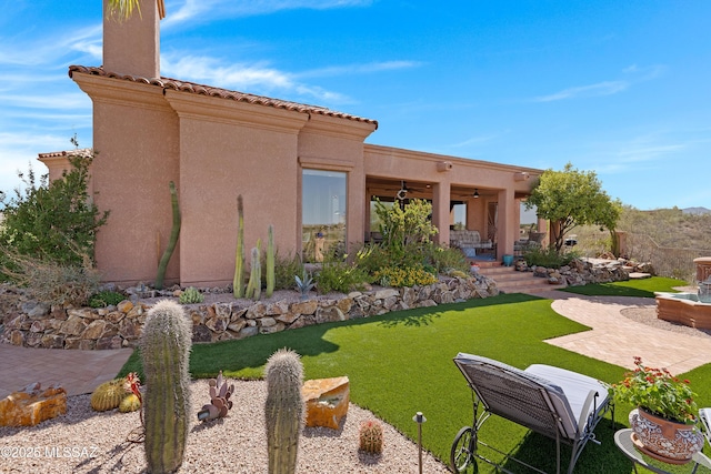 1511 E Placita Meseta Dorada, Oro Valley, AZ 85755 - back of house with a patio area, a ceiling fan, stucco siding, and a yard