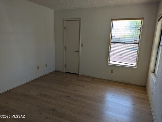 7088 S Camino Grande, Tucson, AZ 85746 - empty room featuring wood finished floors