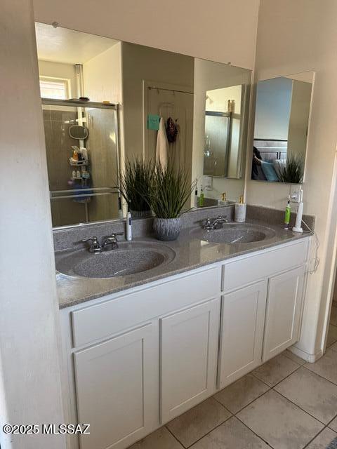 9150 N Wagon Spoke Ct, Tucson, AZ 85742 - bathroom with tile patterned flooring and double vanity