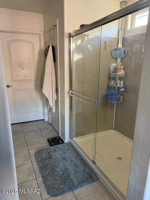 9150 N Wagon Spoke Ct, Tucson, AZ 85742 - full bathroom featuring tile patterned flooring and a shower stall