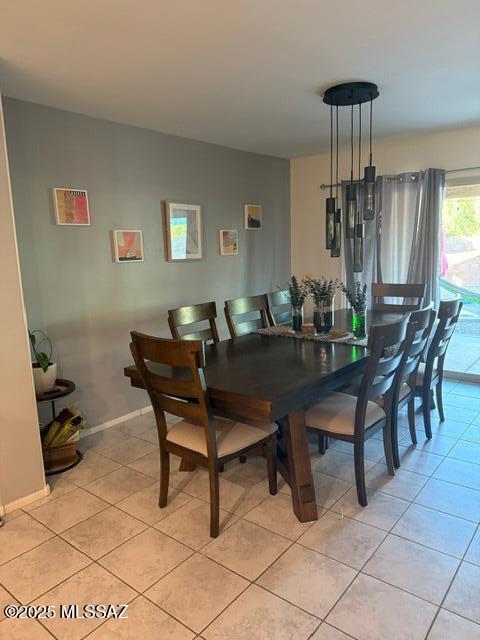 9150 N Wagon Spoke Ct, Tucson, AZ 85742 - dining space featuring light tile patterned floors