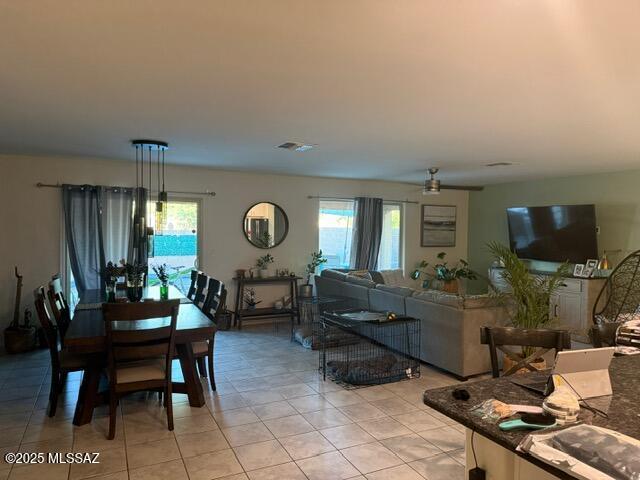 9150 N Wagon Spoke Ct, Tucson, AZ 85742 - living room with plenty of natural light, light tile patterned flooring, and a ceiling fan