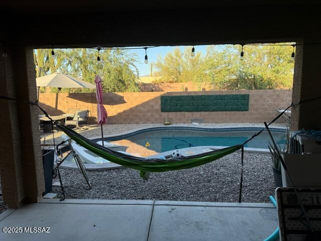 9150 N Wagon Spoke Ct, Tucson, AZ 85742 - view of pool with a fenced backyard and a patio