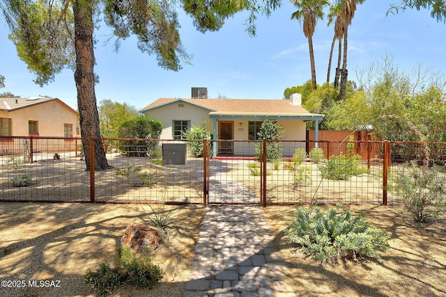 2421 E Drachman St, Tucson, AZ 85719 - single story home featuring stucco siding, a gate, a fenced front yard, and a porch