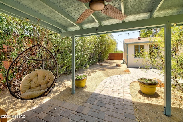2421 E Drachman St, Tucson, AZ 85719 - fenced backyard featuring a ceiling fan and a patio area