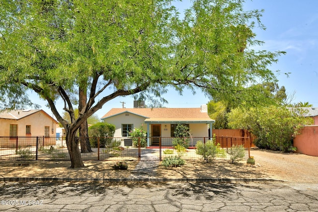 2421 E Drachman St, Tucson, AZ 85719 - view of front facade featuring a fenced front yard and stucco siding