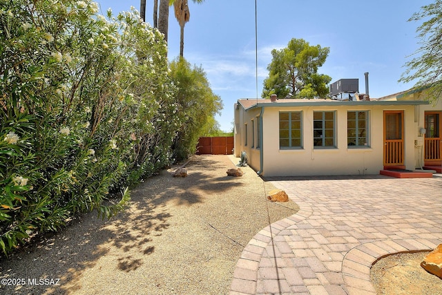 2421 E Drachman St, Tucson, AZ 85719 - rear view of house featuring stucco siding and a patio area