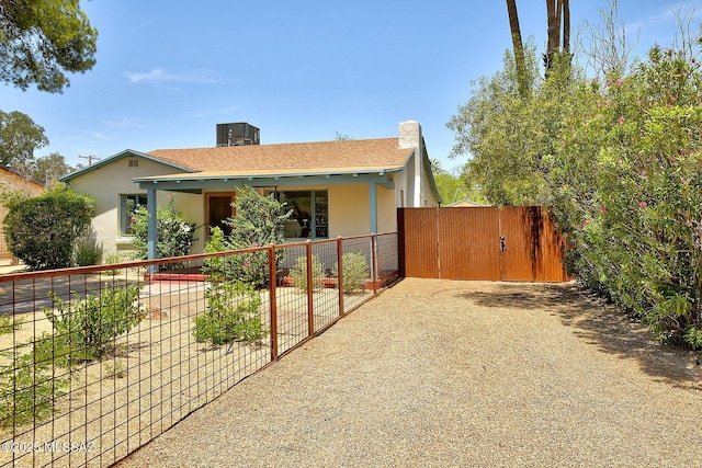 2421 E Drachman St, Tucson, AZ 85719 - ranch-style house featuring a gate, stucco siding, and a shingled roof
