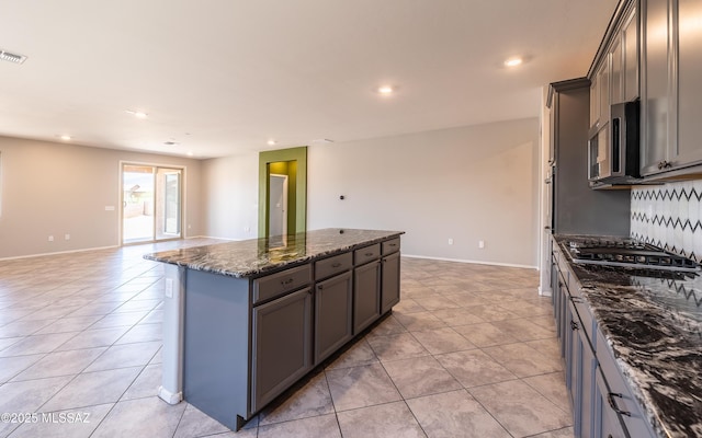 8820 E Stone Meadow Cir, Tucson, AZ 85730 - kitchen with stainless steel appliances, light tile patterned floors, a center island, gray cabinets, and recessed lighting
