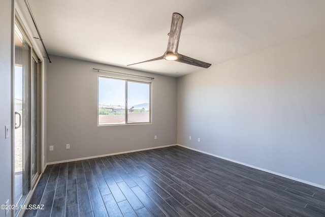 8820 E Stone Meadow Cir, Tucson, AZ 85730 - spare room featuring dark wood-style flooring and a ceiling fan