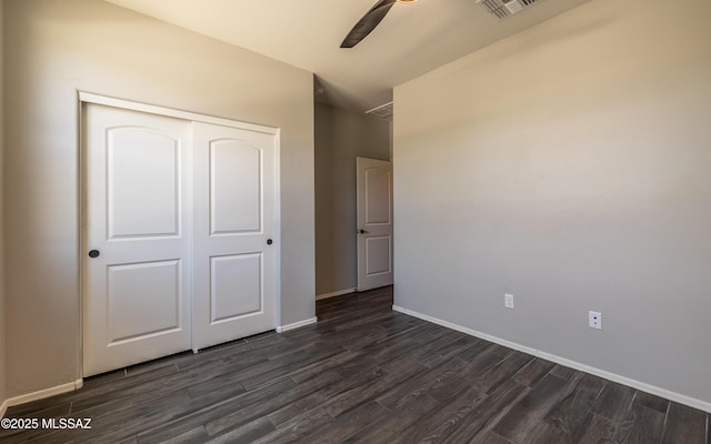 8820 E Stone Meadow Cir, Tucson, AZ 85730 - unfurnished bedroom with dark wood-type flooring, a closet, and a ceiling fan