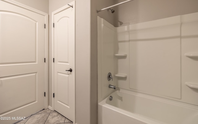 8820 E Stone Meadow Cir, Tucson, AZ 85730 - bathroom with  shower combination and tile patterned floors