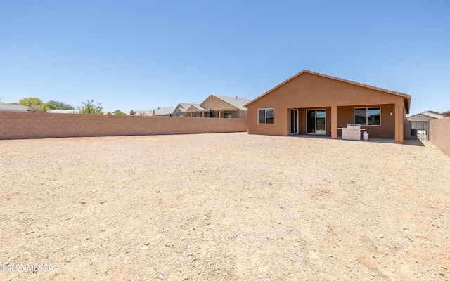 8820 E Stone Meadow Cir, Tucson, AZ 85730 - back of property with a patio, stucco siding, and a fenced backyard