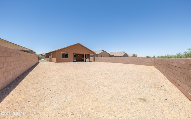 8820 E Stone Meadow Cir, Tucson, AZ 85730 - back of property featuring a fenced backyard and stucco siding