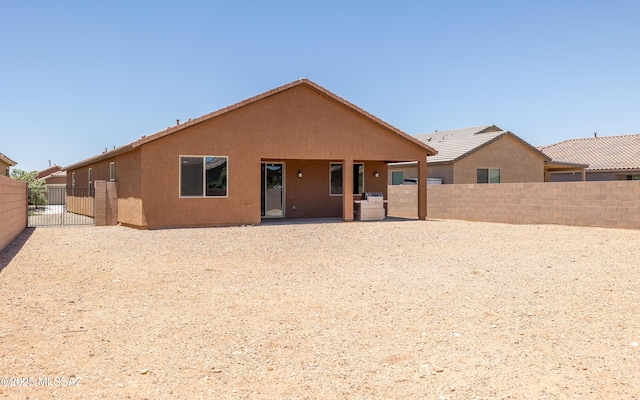 8820 E Stone Meadow Cir, Tucson, AZ 85730 - back of house with a fenced backyard, stucco siding, and a patio area