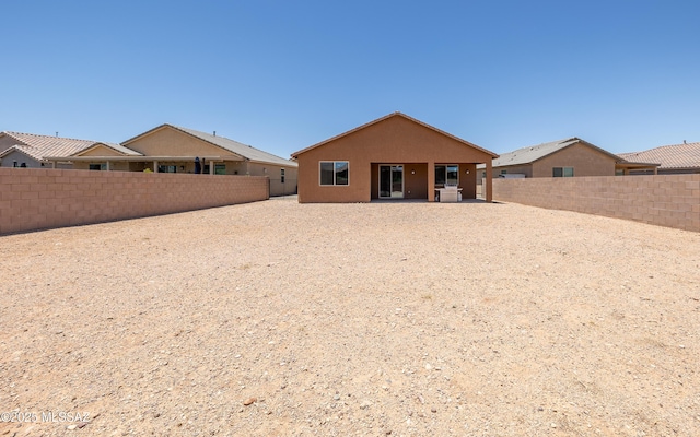 8820 E Stone Meadow Cir, Tucson, AZ 85730 - rear view of house with a patio, a fenced backyard, and stucco siding