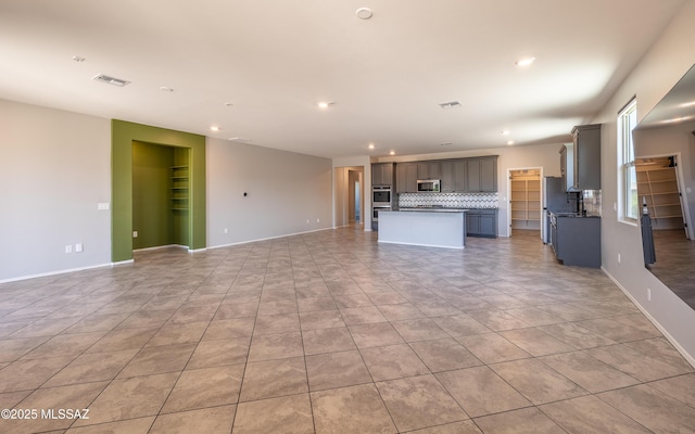 8820 E Stone Meadow Cir, Tucson, AZ 85730 - unfurnished living room with recessed lighting and light tile patterned flooring