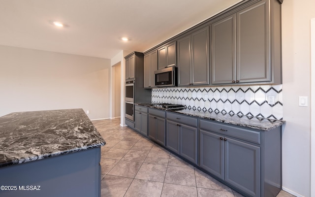 8820 E Stone Meadow Cir, Tucson, AZ 85730 - kitchen with appliances with stainless steel finishes, decorative backsplash, dark stone counters, recessed lighting, and light tile patterned floors