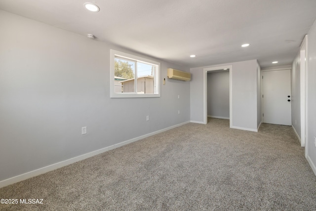 5609 E Juarez St, Tucson, AZ 85711 - unfurnished bedroom featuring an AC wall unit, light carpet, recessed lighting, and a closet