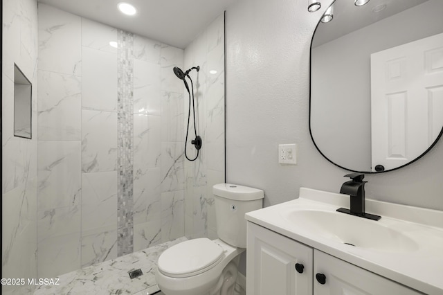 5609 E Juarez St, Tucson, AZ 85711 - full bathroom featuring vanity, a marble finish shower, and recessed lighting
