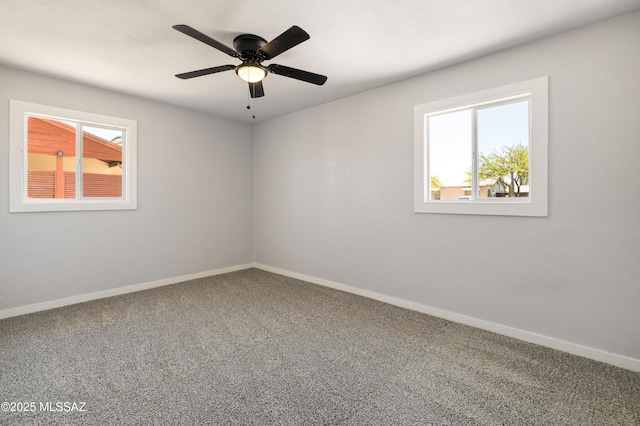 5609 E Juarez St, Tucson, AZ 85711 - carpeted empty room featuring baseboards and a ceiling fan