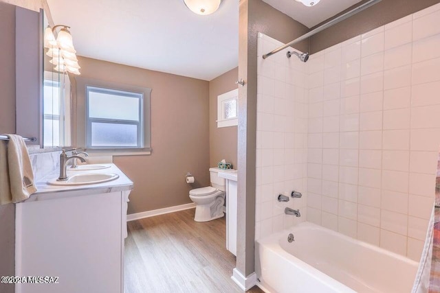 201 B St, Bisbee, AZ 85603 - full bathroom with double vanity, wood finished floors, and shower / bath combination
