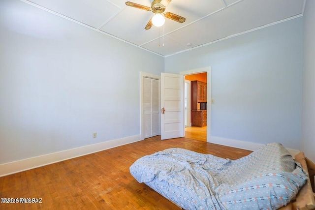 201 B St, Bisbee, AZ 85603 - bedroom featuring wood finished floors, a closet, and ceiling fan