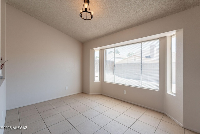 3556 W Avenida Del Mar, Tucson, AZ 85746 - unfurnished room with a textured ceiling, light tile patterned floors, and lofted ceiling