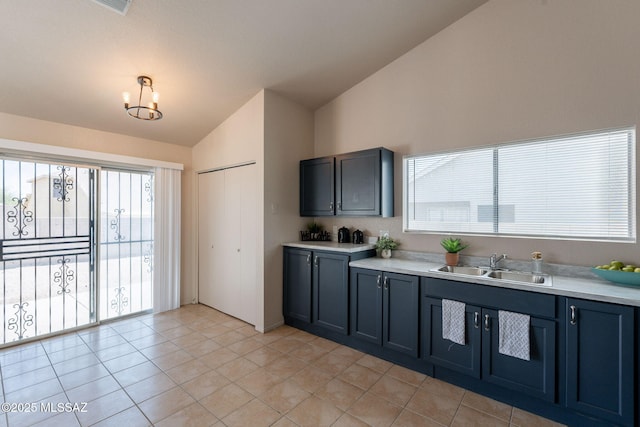 3556 W Avenida Del Mar, Tucson, AZ 85746 - kitchen featuring vaulted ceiling, light countertops, light tile patterned floors, and a chandelier