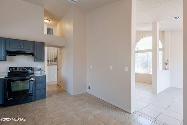 3556 W Avenida Del Mar, Tucson, AZ 85746 - kitchen featuring black electric range oven, under cabinet range hood, light countertops, light tile patterned floors, and blue cabinets