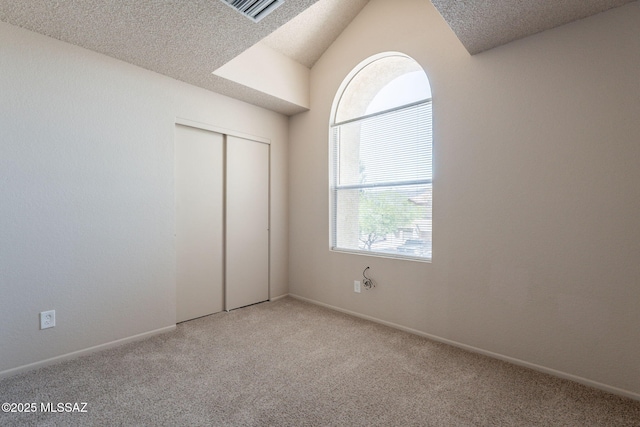 3556 W Avenida Del Mar, Tucson, AZ 85746 - unfurnished bedroom with light colored carpet, a closet, and a textured ceiling
