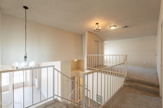 3556 W Avenida Del Mar, Tucson, AZ 85746 - stairs featuring a chandelier, carpet floors, lofted ceiling, and a textured ceiling