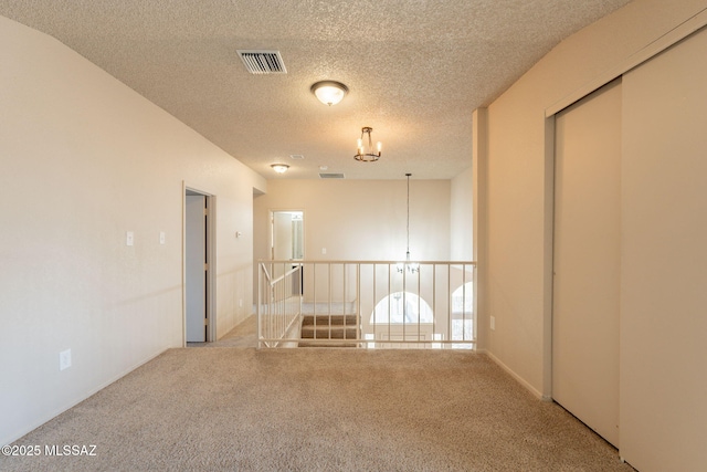 3556 W Avenida Del Mar, Tucson, AZ 85746 - carpeted spare room featuring a textured ceiling and a chandelier