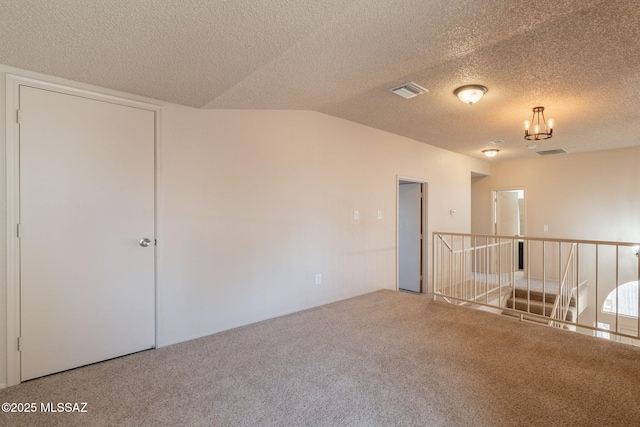 3556 W Avenida Del Mar, Tucson, AZ 85746 - spare room featuring carpet, a chandelier, a textured ceiling, and lofted ceiling