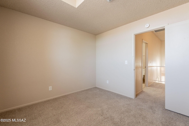 3556 W Avenida Del Mar, Tucson, AZ 85746 - unfurnished room featuring light carpet, a textured ceiling, and a smoke detector
