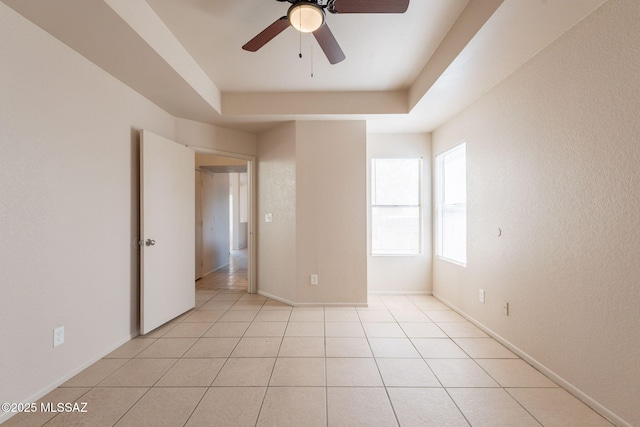 3556 W Avenida Del Mar, Tucson, AZ 85746 - unfurnished room with a ceiling fan, light tile patterned floors, and a tray ceiling