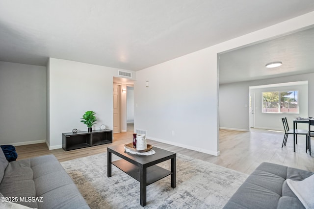 3872 S Evergreen Ave, Tucson, AZ 85730 - living area with light wood-style flooring and baseboards