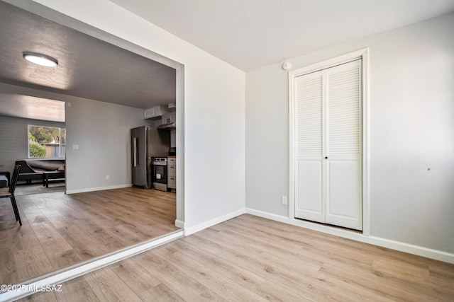 3872 S Evergreen Ave, Tucson, AZ 85730 - unfurnished living room featuring wood finished floors