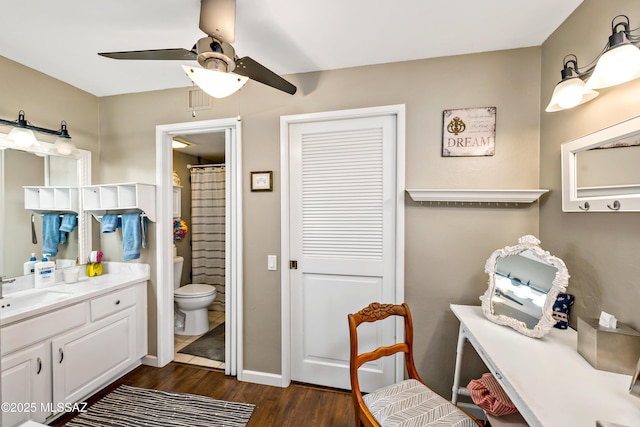 1939 S San Vincent Dr, Green Valley, AZ 85614 - full bathroom with ceiling fan, wood finished floors, vanity, and curtained shower