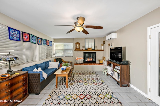 1939 S San Vincent Dr, Green Valley, AZ 85614 - living room featuring an AC wall unit, light tile patterned flooring, ceiling fan, and a glass covered fireplace